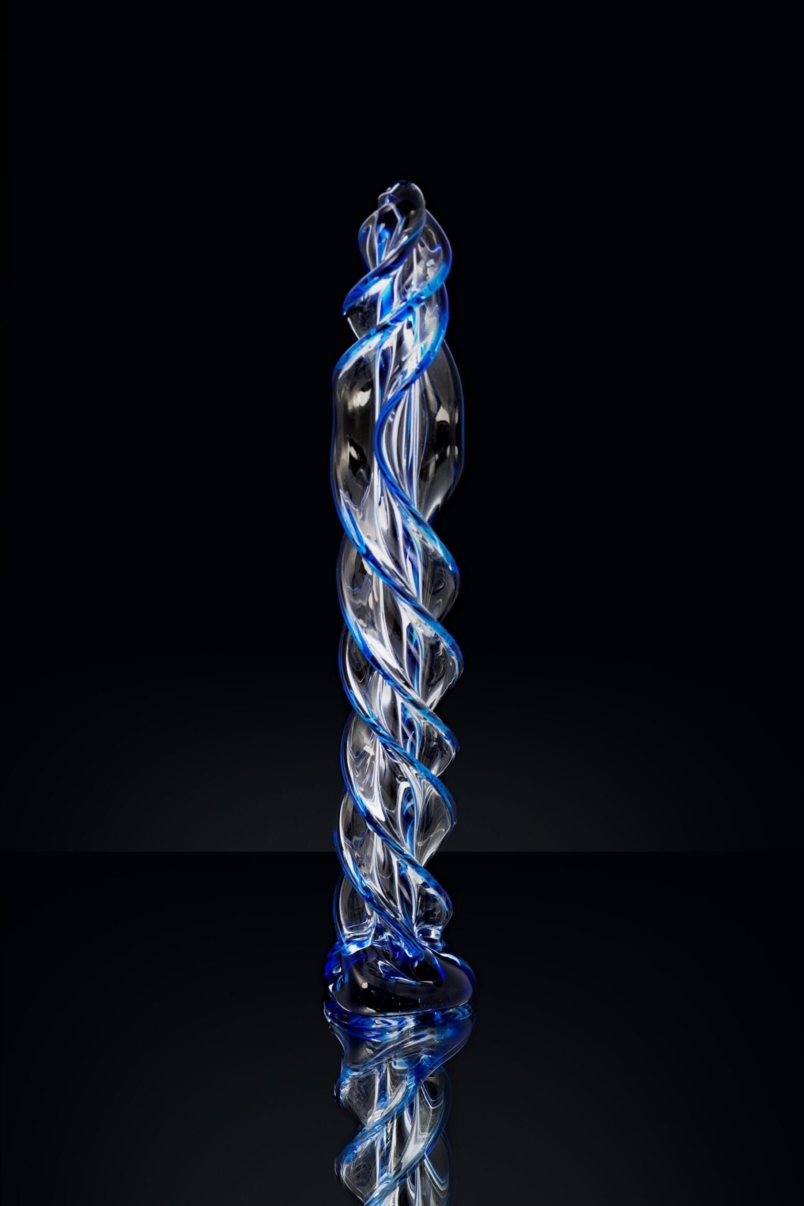 Clear-colored-Butt-plug-made-of-glass-on-a-black-background-1-scaled-1